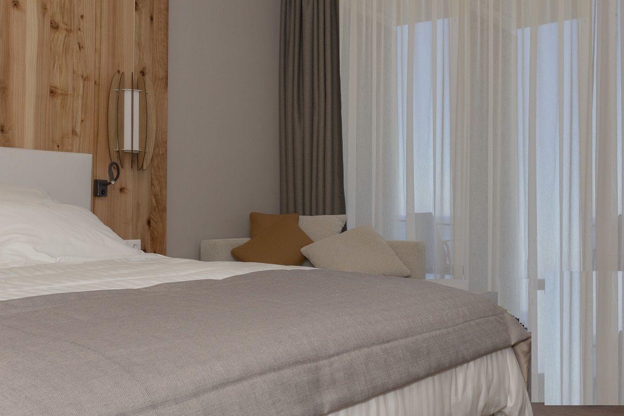 Pedras Do Mar Resort & Spa Fenais da Luz Bagian luar foto A bedroom with a bed and a sofa